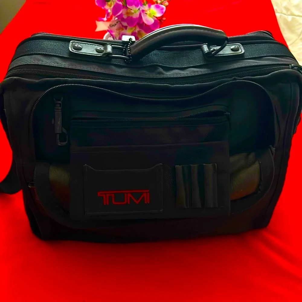 Tumi Black brief case/messenger bag